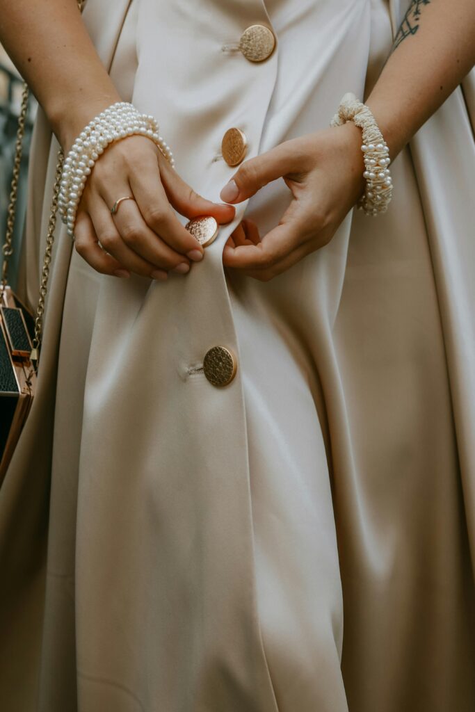 Elegant sustainable fashion with upcycled silk dress and fair-trade accessories